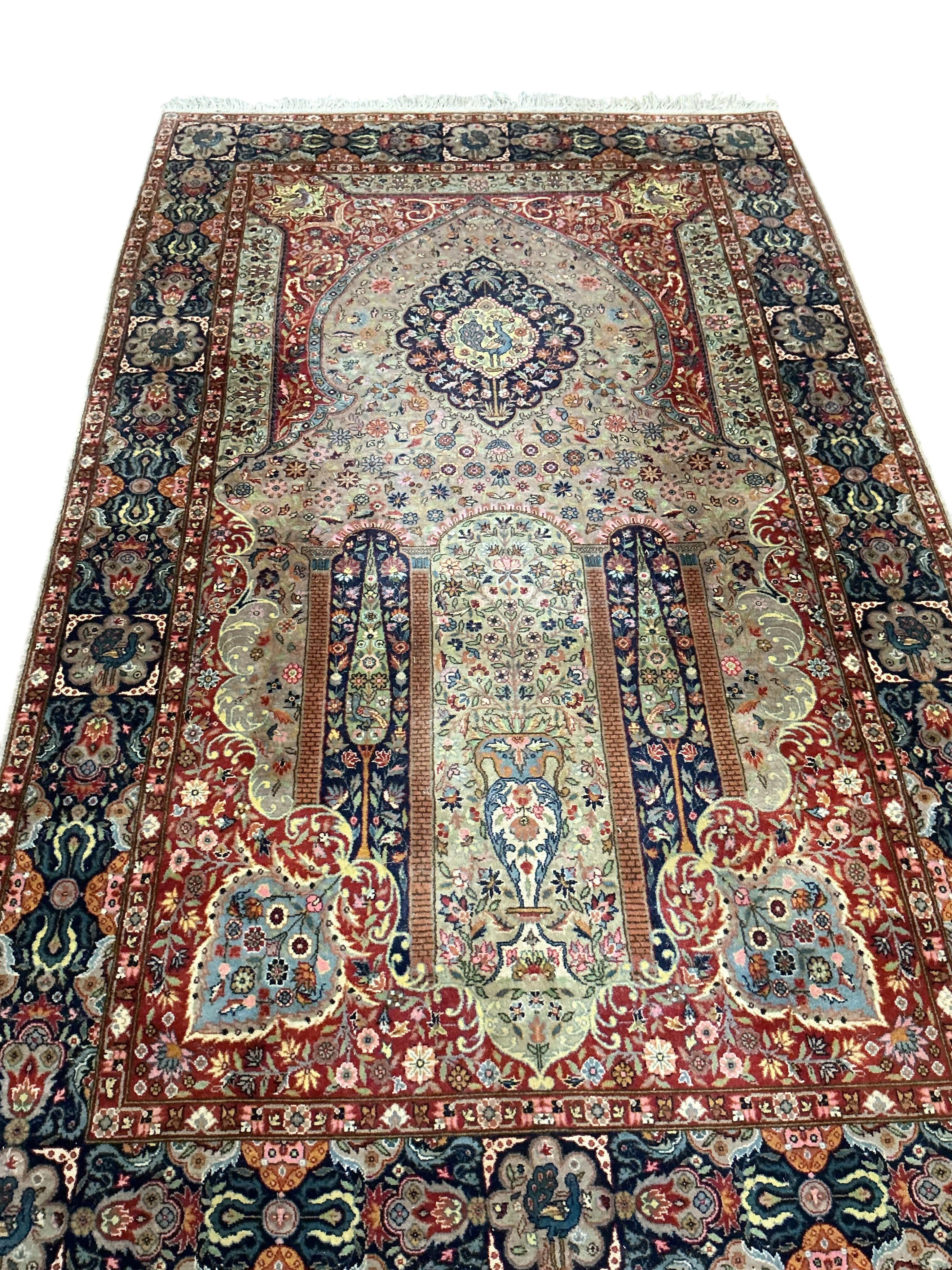 A Kerman prayer rug, the floral field with a Mihrab, 230 x 139cm